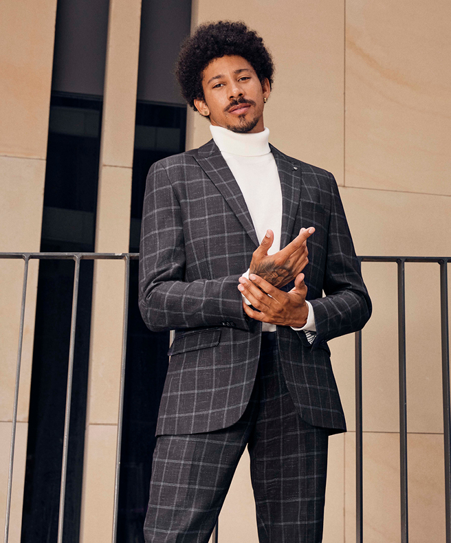 Windowpane suit and white roll neck sweater 