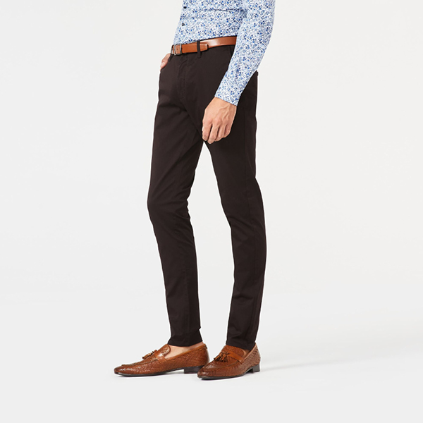 Model wearing dark brown ultra slim winsor chino with blue floral shirtt