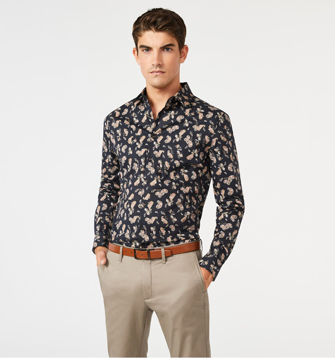 Model wearing dark navy floral shirt with paisley patterns Model wearing dark navy floral shirt with paisley patterns