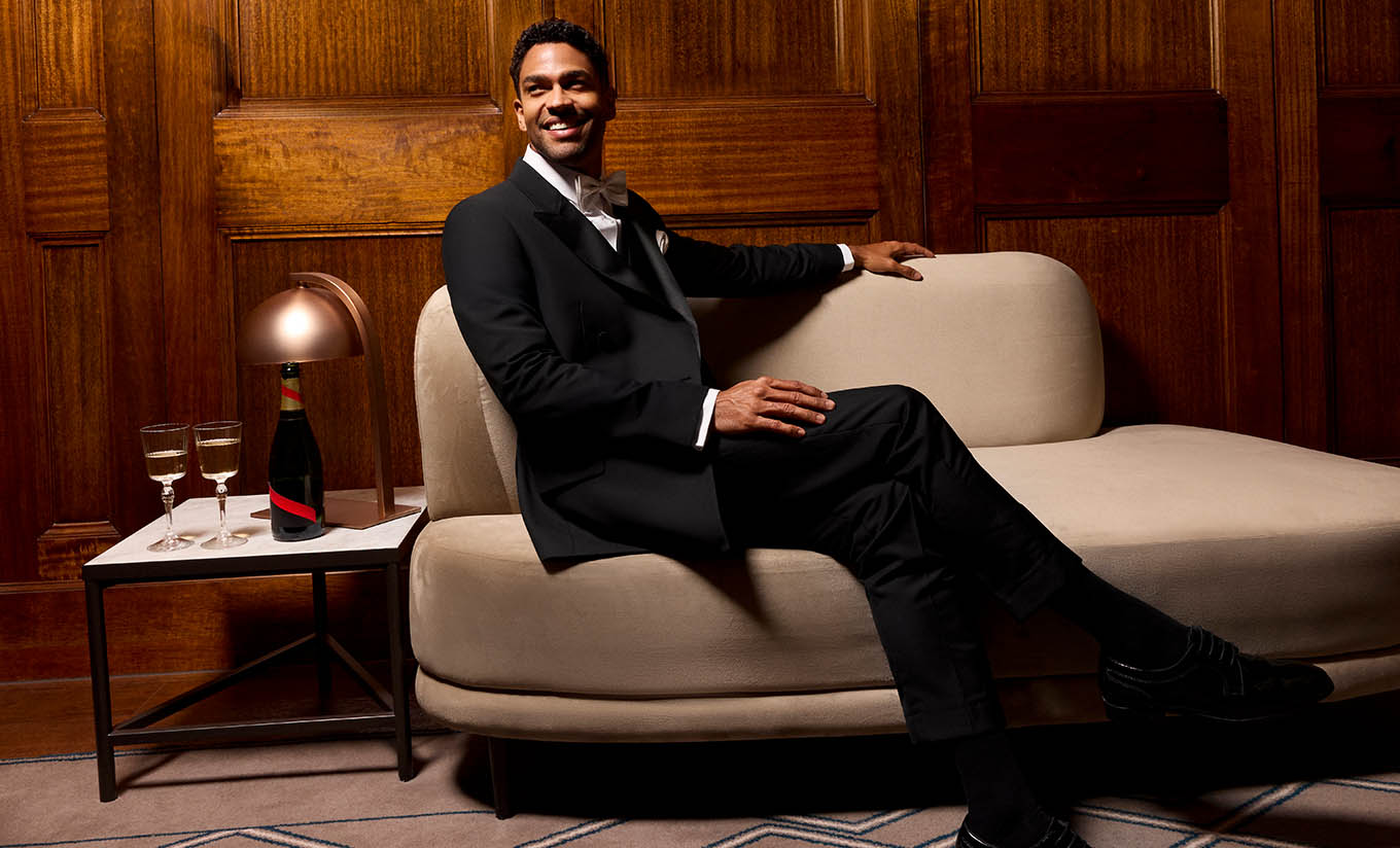 male in black tuxedo sitting down