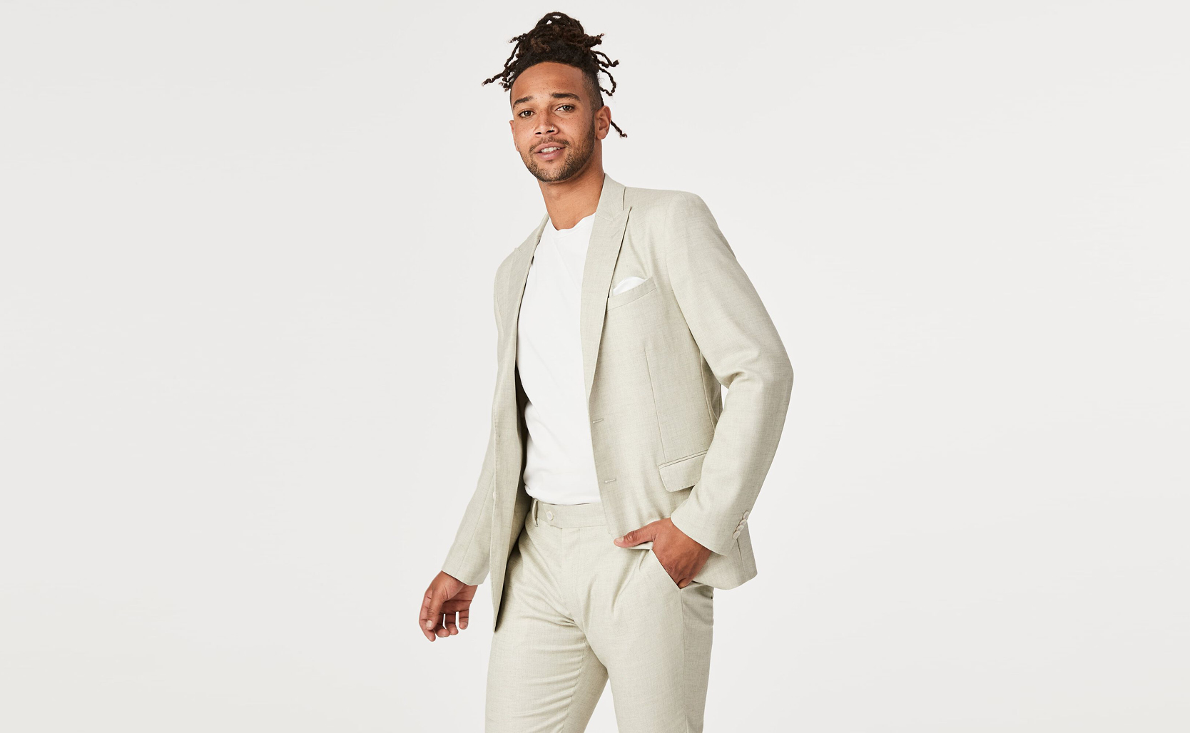 Featuring a crisp two-piece suit in off-white, coupled with a pristine white tee. Featuring a crisp two-piece suit in off-white, coupled with a pristine white tee.