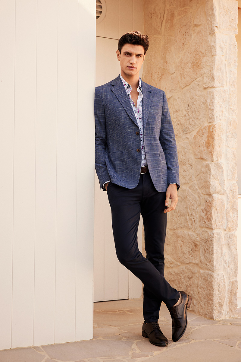 POLITIX Spring Summer 2025 navy check blazer styled with floral shirt and tailored chinos – elevated smart casual menswear for spring events and weekend occasions."