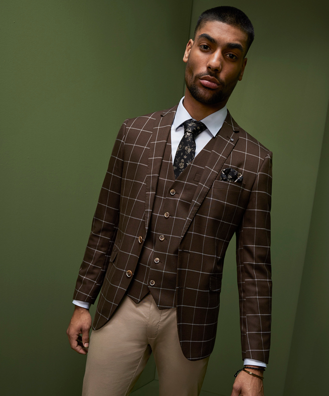 Model wearing three piece with vest POLITIX suit Chocolate 